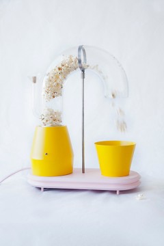 Popcorn-Monsoon-A-Whimsical-Popcorn-Maker-Shoots-Popcorn-Out-of-a-Curved