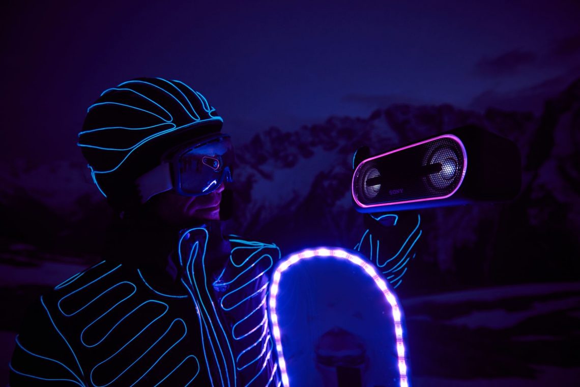 Snowboarders in LED suits