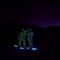 Snowboarders in LED suits