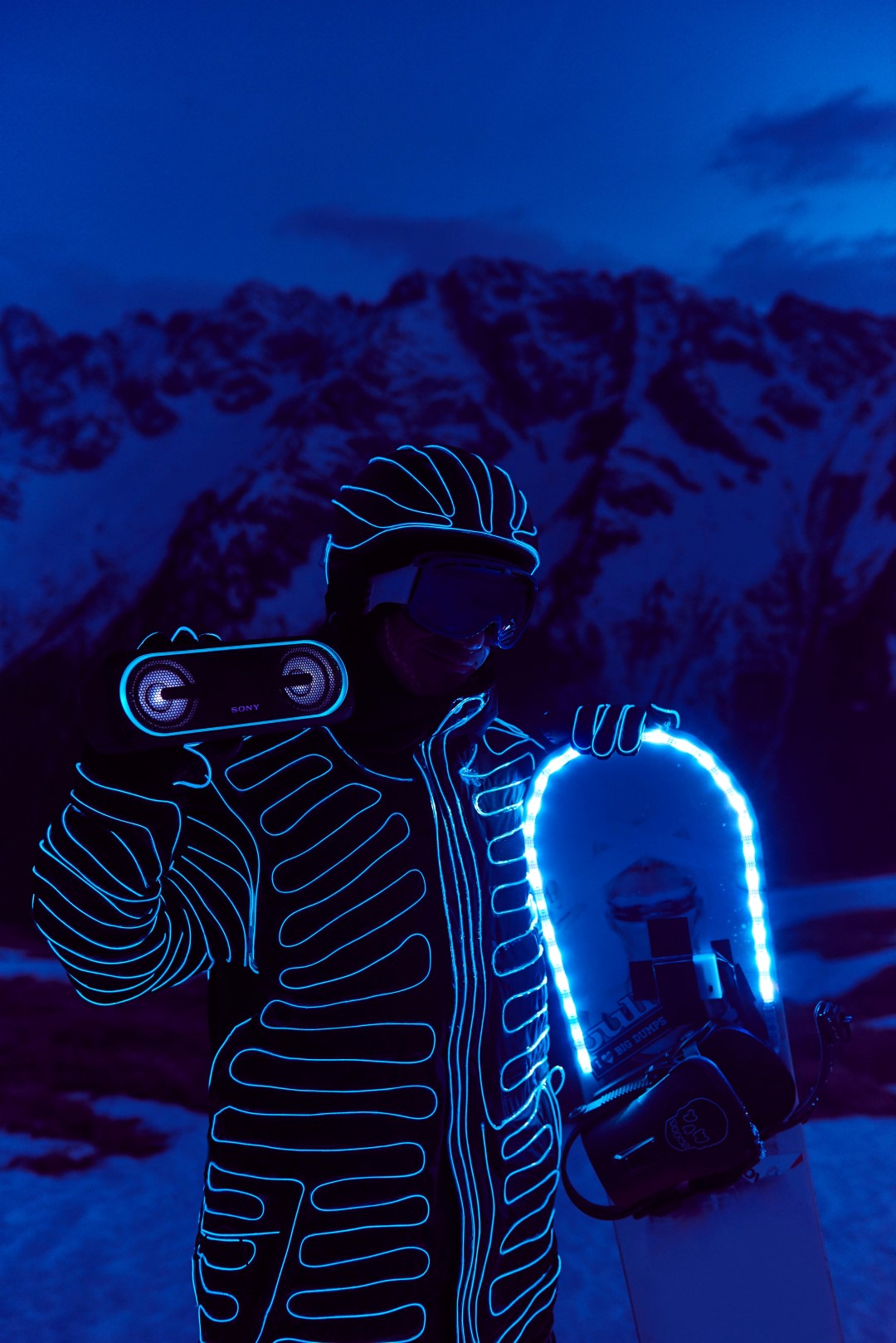 Snowboarders in LED suits