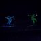 Snowboarders in LED suits